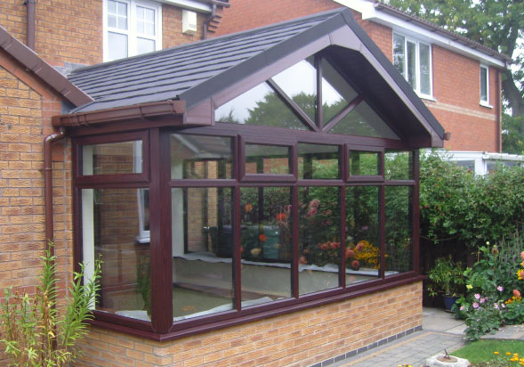 A replacement solid conservatory roof on a gable ended roof conservatory