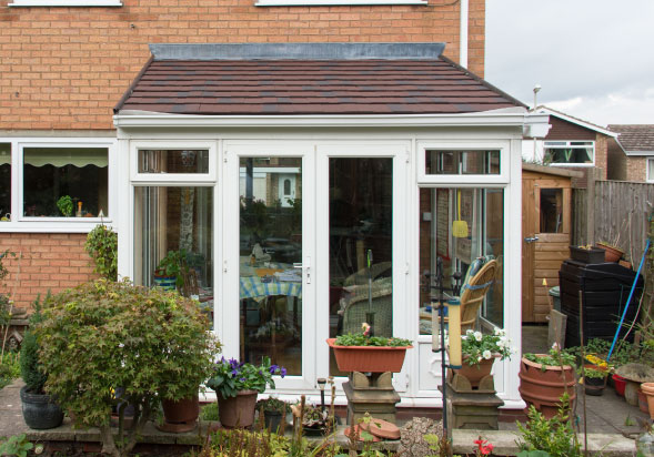 A new solid roof installed on a lean to roof style conservatory