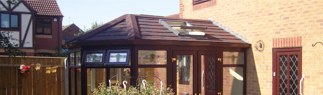 A conservatory solid roof with roof windows installed